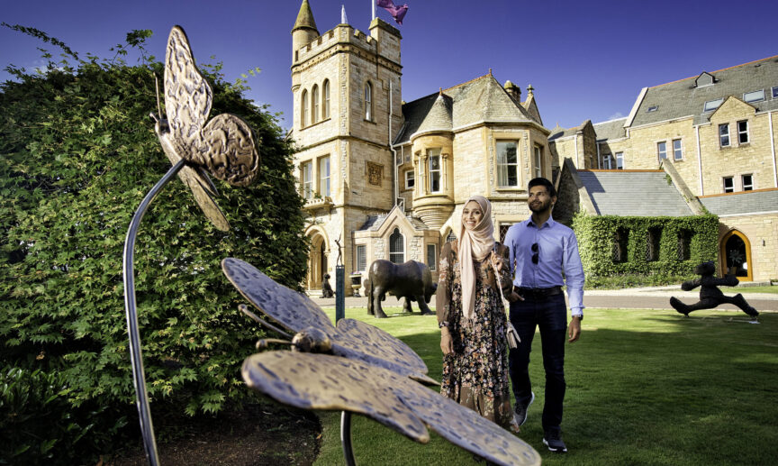 Couple exploring the gardens at Culloden Hotel Estate Spa Holywood Co master Faithlegg